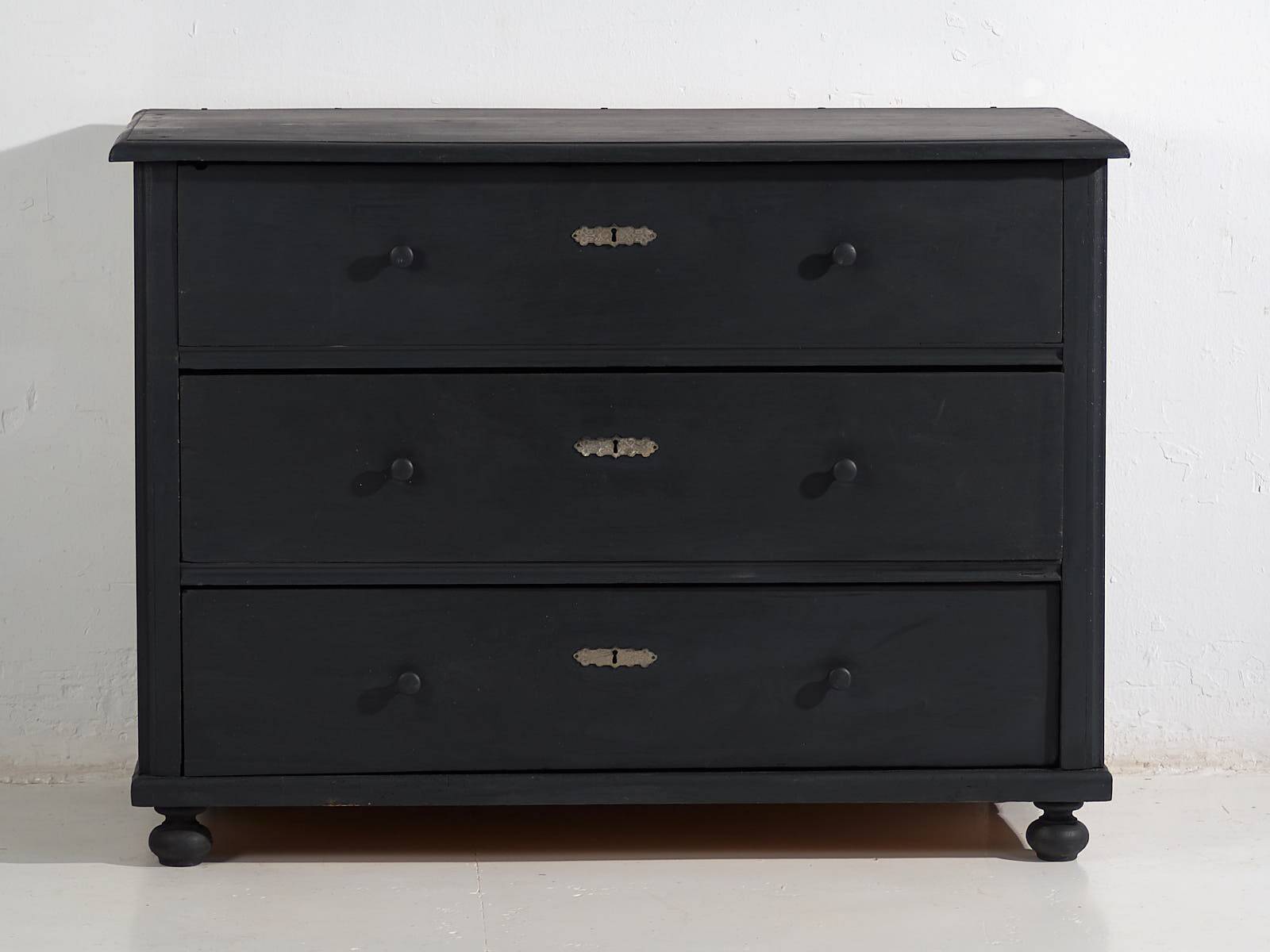 Antique chest of drawers in dark tones (c.1920)