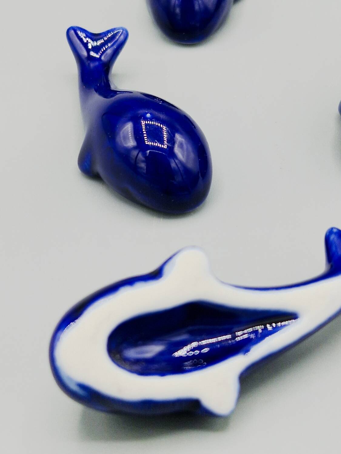 Set of 6 vintage blue porcelain whale knife rests.