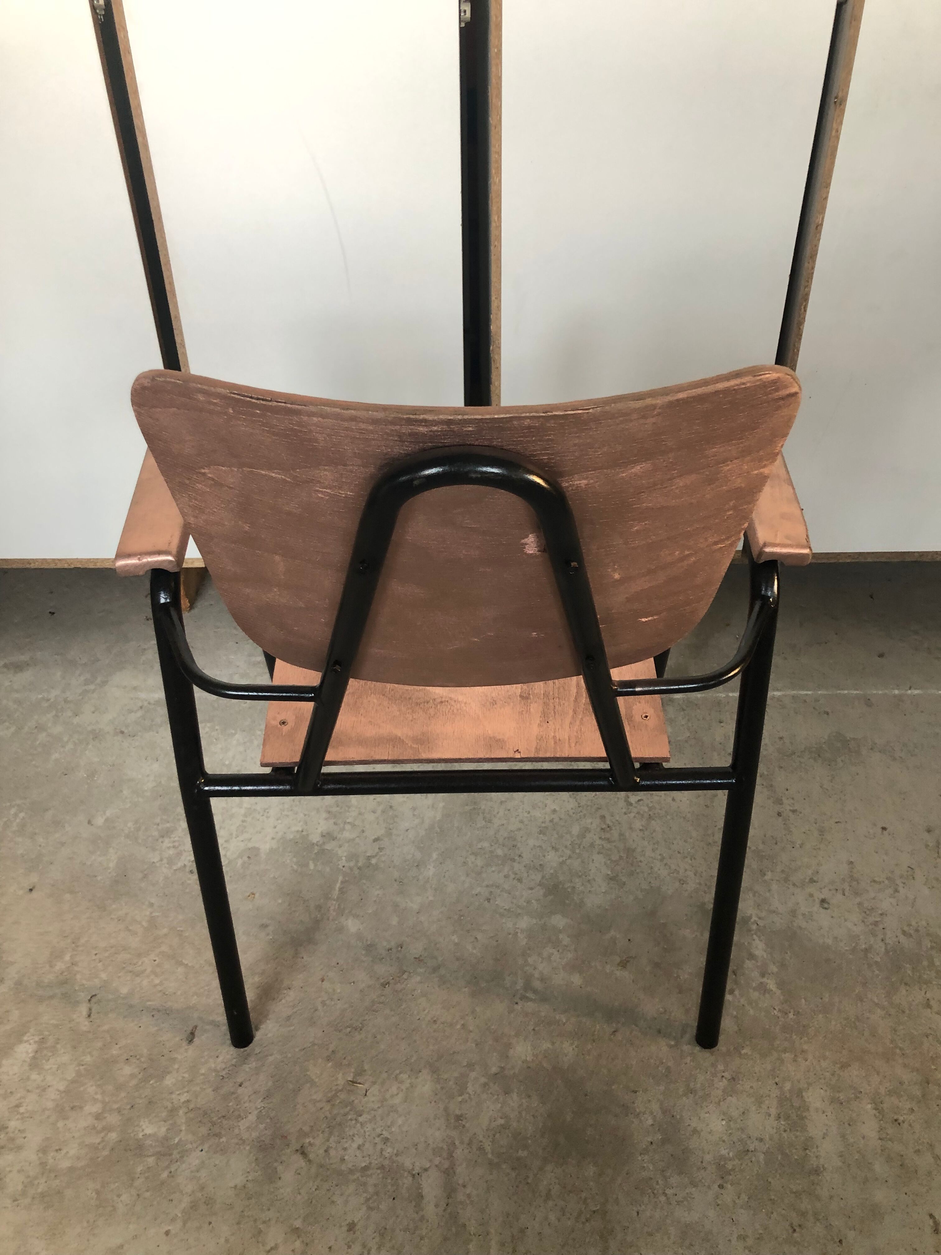 Old chair with armrest restored in metallic pink