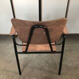 Old chair with armrest restored in metallic pink
