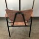Old chair with armrest restored in metallic pink