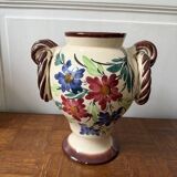 Ceramic vase with hand-painted floral decoration.