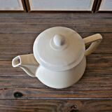 Vintage round ceramic teapot in cream colour, art deco style.