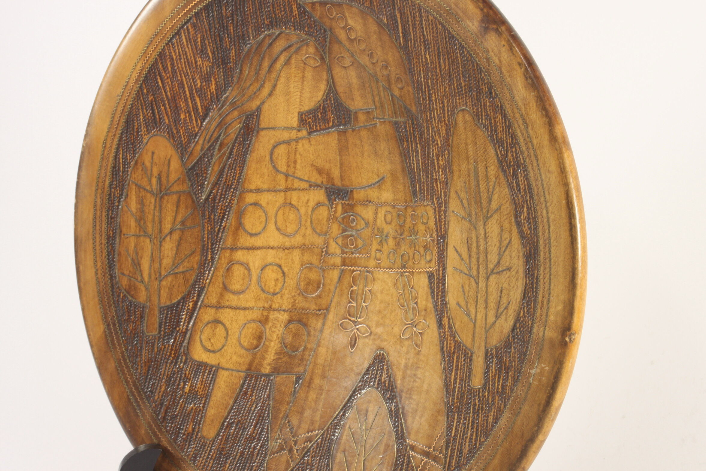 Scandinavian brass inlaid wooden plate with figures, 1960s.