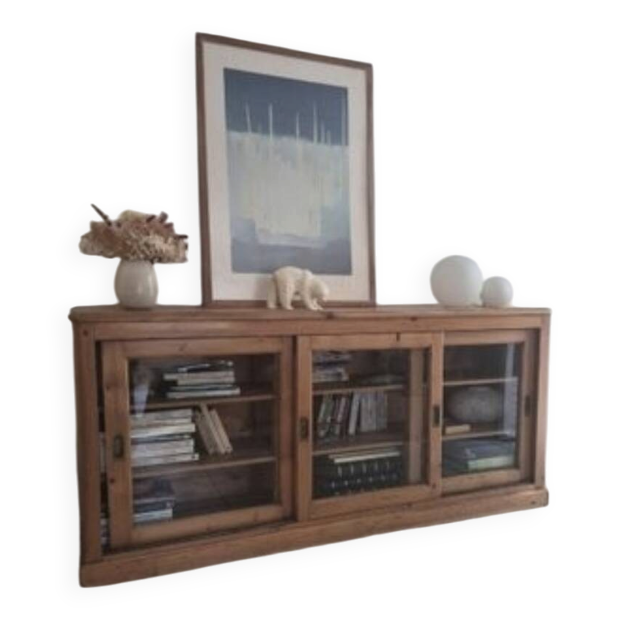 Antique wooden sideboard with three sliding glass doors.