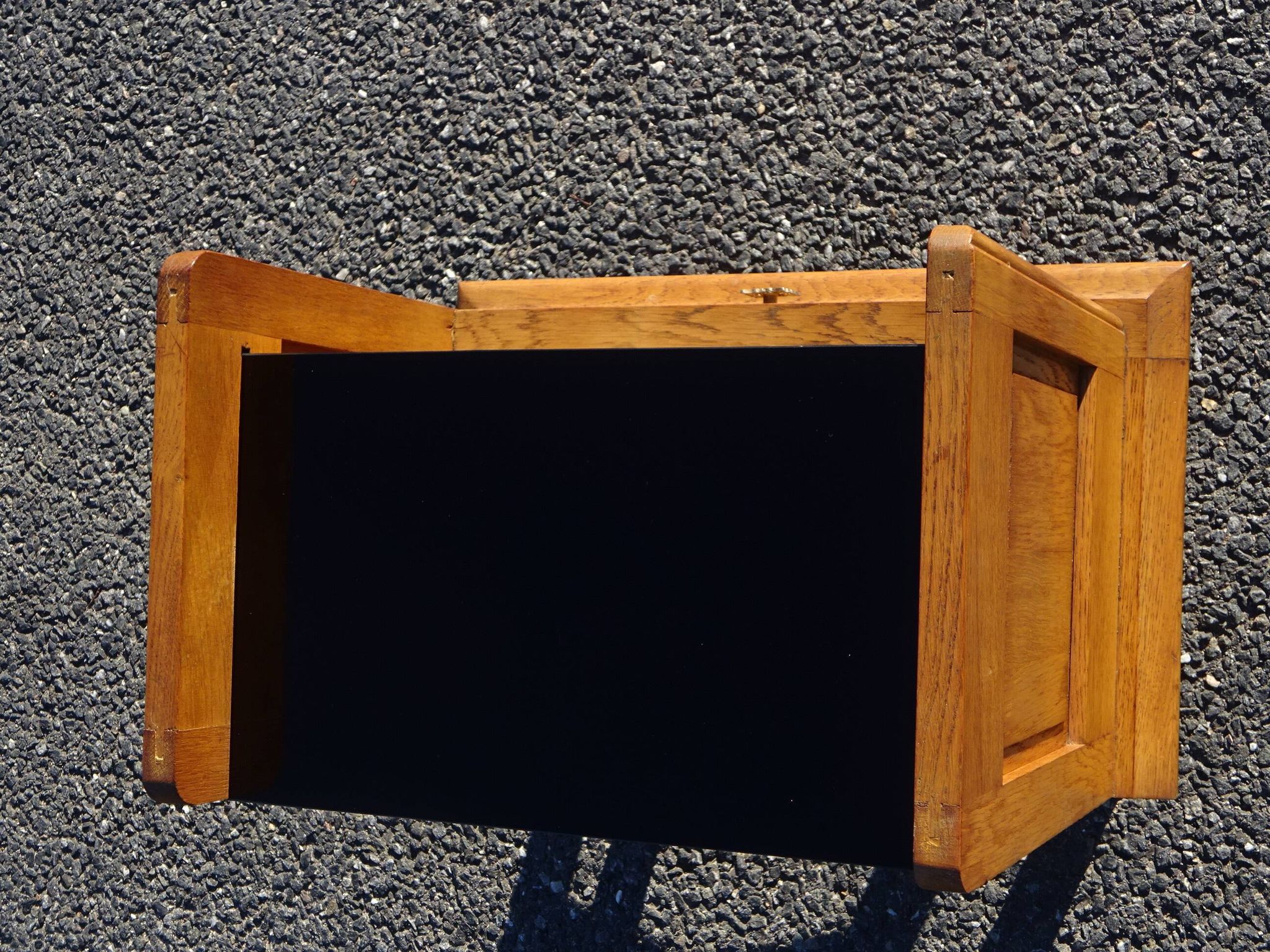 Vintage oak bedside table with tapered legs.