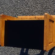 Vintage oak bedside table with tapered legs.