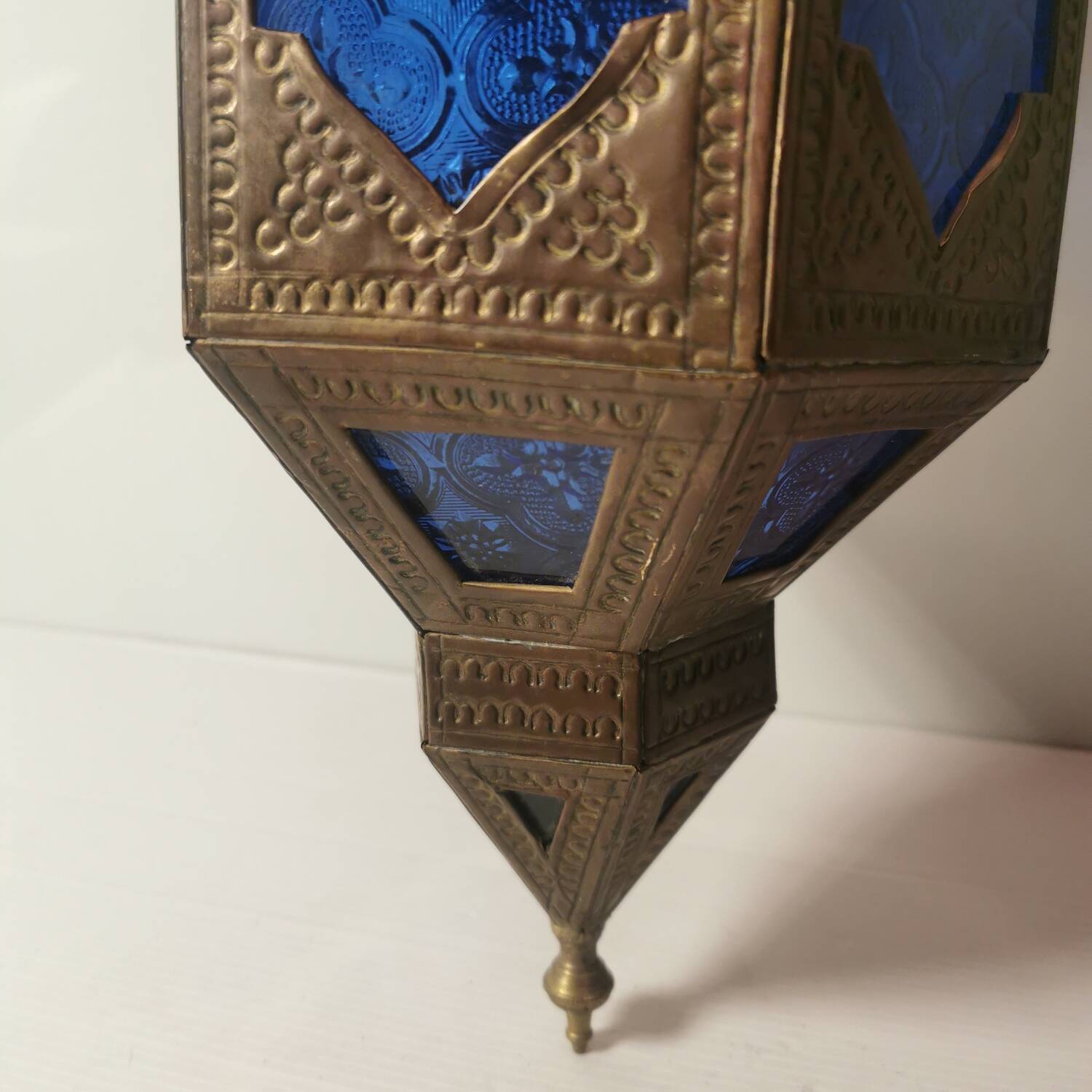 Oriental style hanging lantern in brass and dark blue glass
