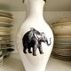 White and gold porcelain vase with black patterns by Mauricio Ortiz