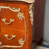 Louis XV style commode. Marquetry, gilded bronze decoration.