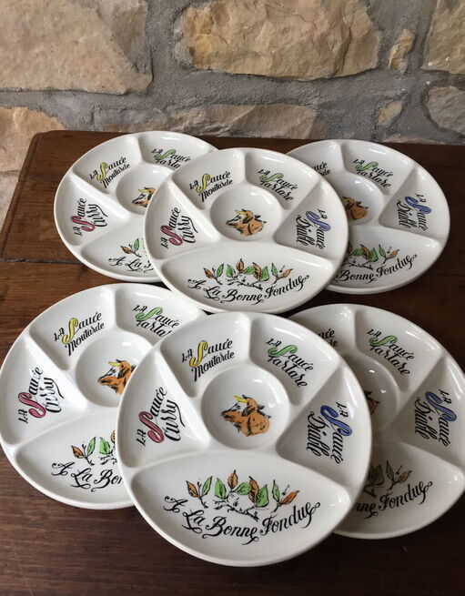 Six fondue plates by Gien