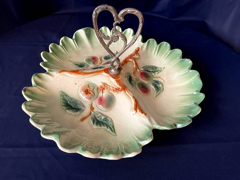 Beggar or servant in barbotine with fruit decoration heart handle