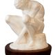 Sculpture of a seated man. Classical male sculpture. Male figure.