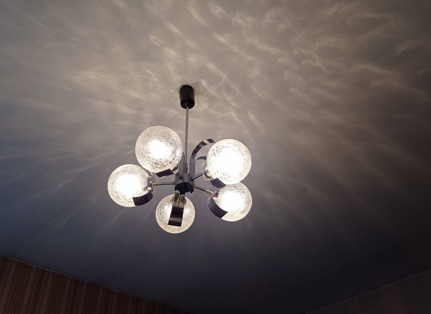 Vintage chandelier with glass globes and chrome steel