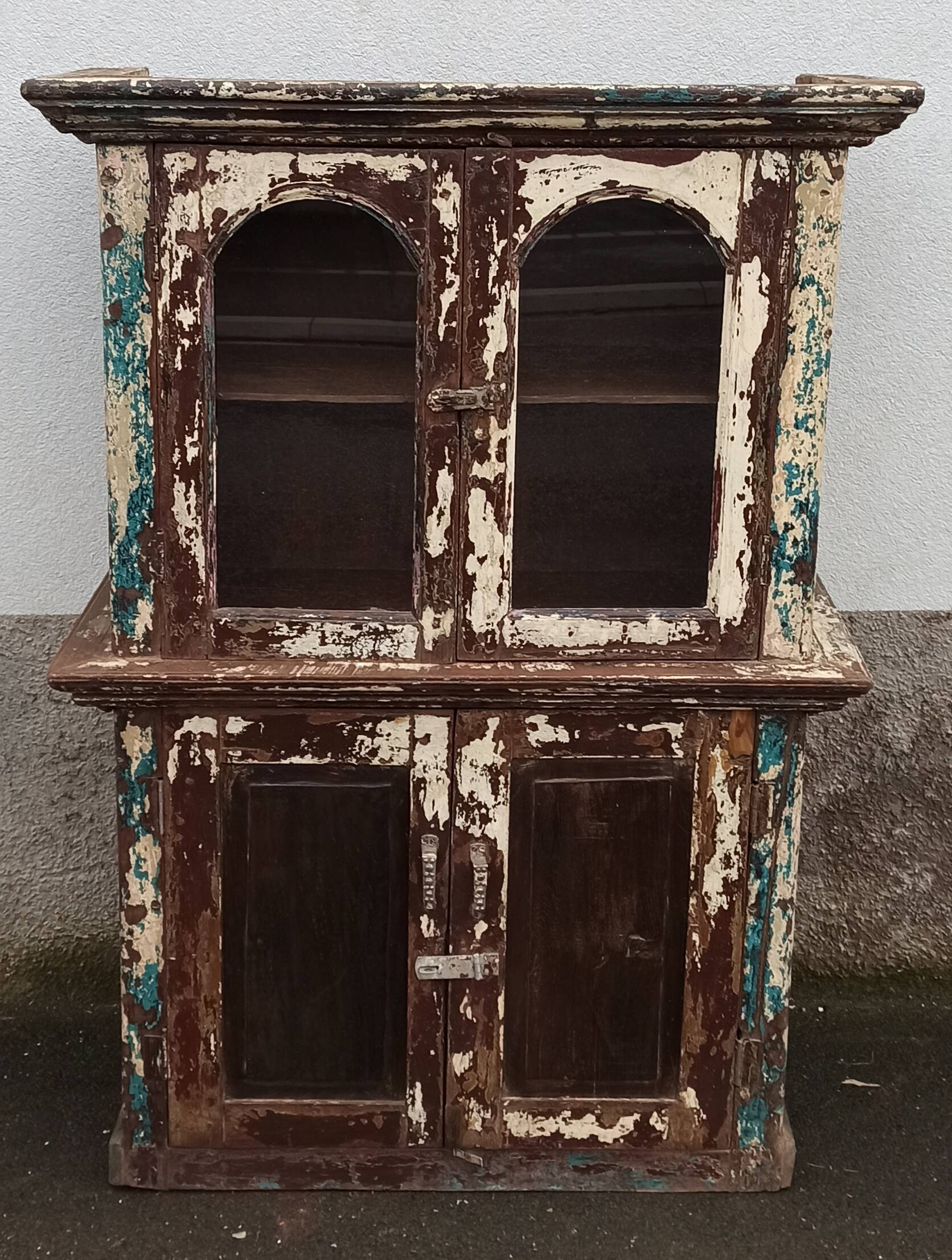 Old patinated wooden glass cabinet