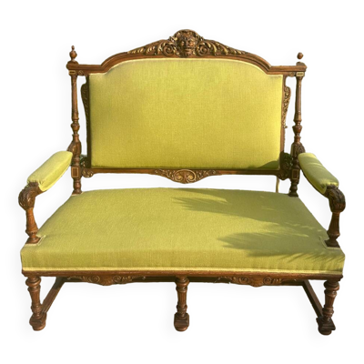 Banquette en bois massif richement sculpté de style Louis XVI .