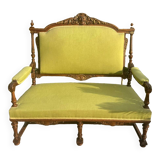 Richly carved solid wood bench in Louis XVI style.