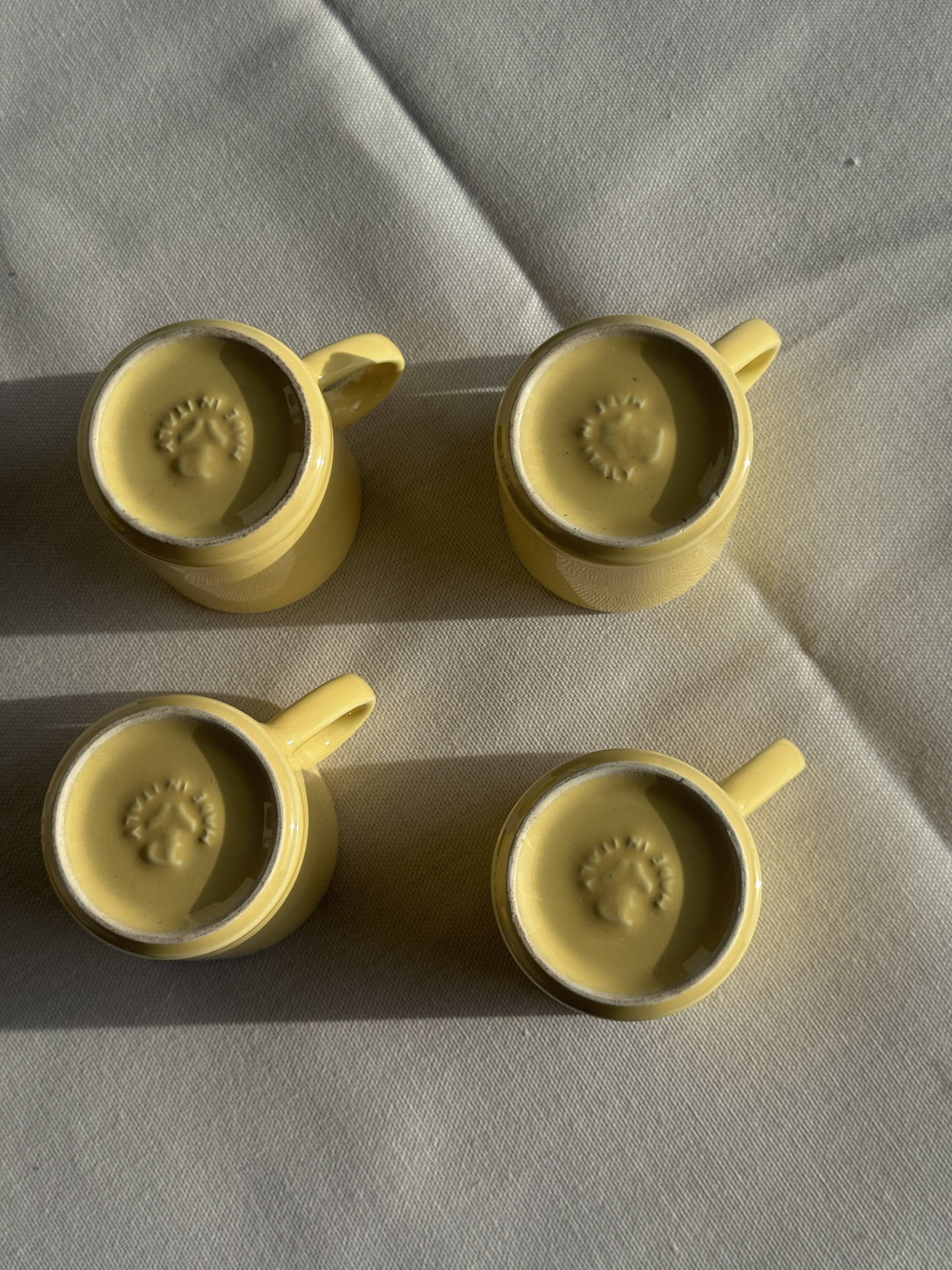 Set of 4 vintage yellow Italian espresso cups and saucers.