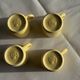 Set of 4 vintage yellow Italian espresso cups and saucers.