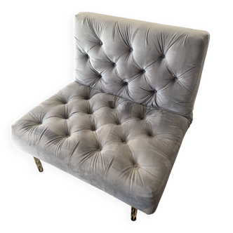 Grey tufted armchair