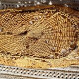 Wicker and dented metal panière