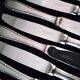 Set of 12 monobloc table knives in Comargent steel.