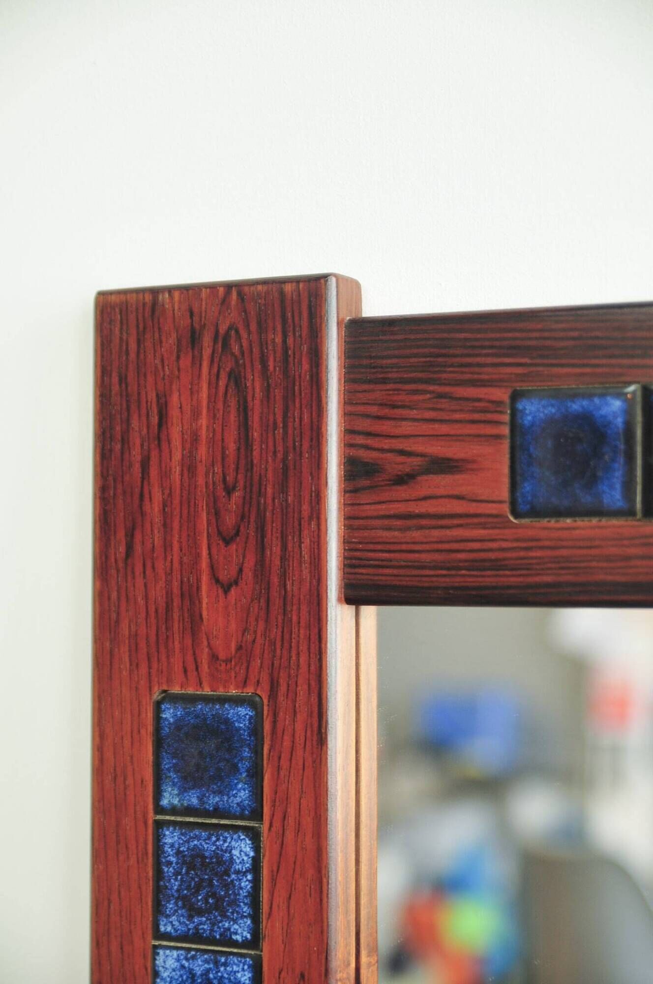 Rosewood mirror with blue ceramic tiles