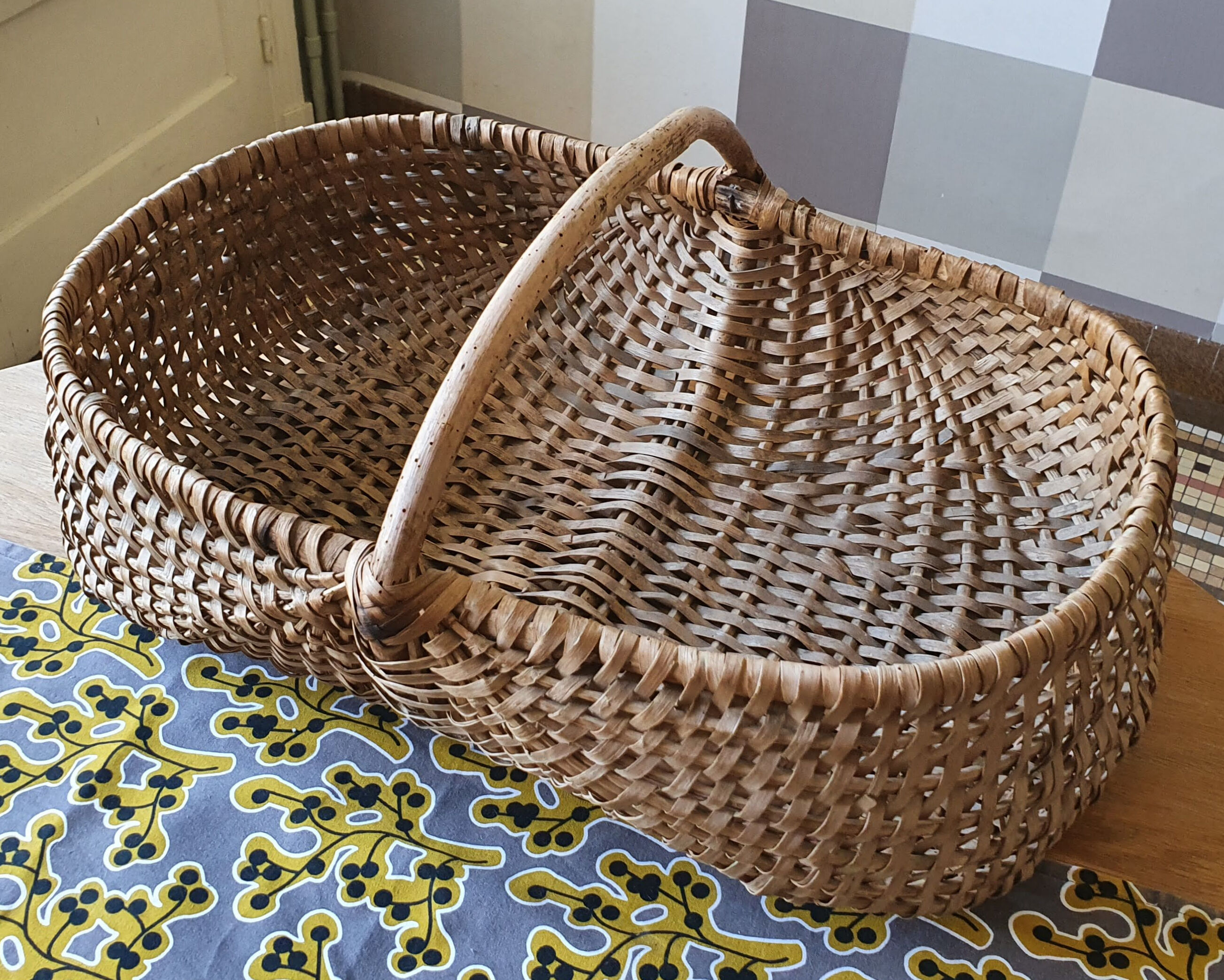 Burgundy basket in braided wicker