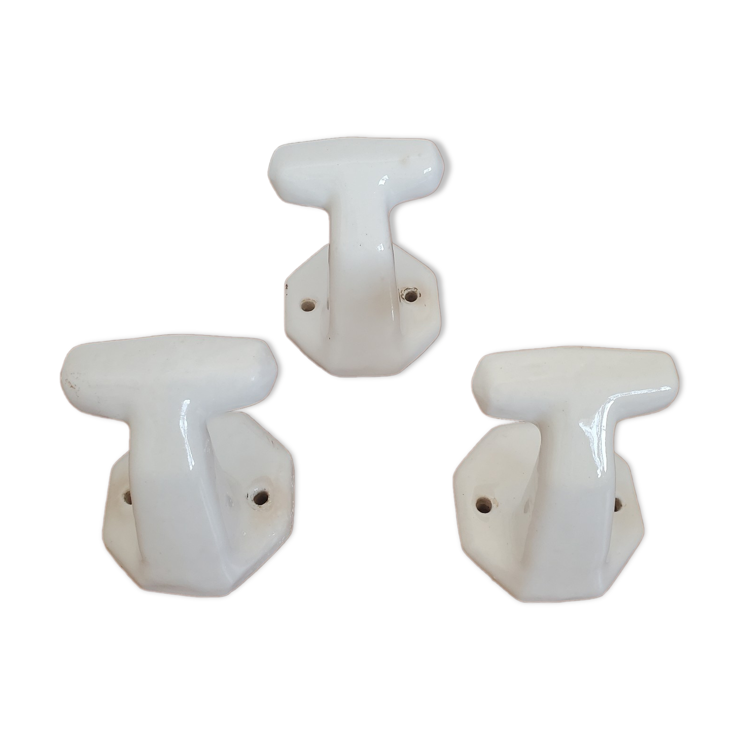 Trio of white porcelain hooks