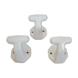Trio of white porcelain hooks