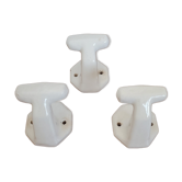 Trio of white porcelain hooks