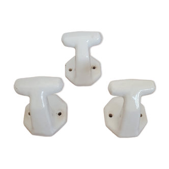 Trio of white porcelain hooks