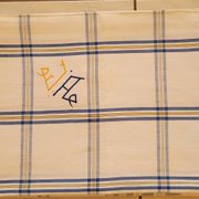 Cotton tablecloth for 12 place settings with napkins.