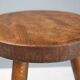 French hand crafted brutalist rustic low tripod stool in solid wood