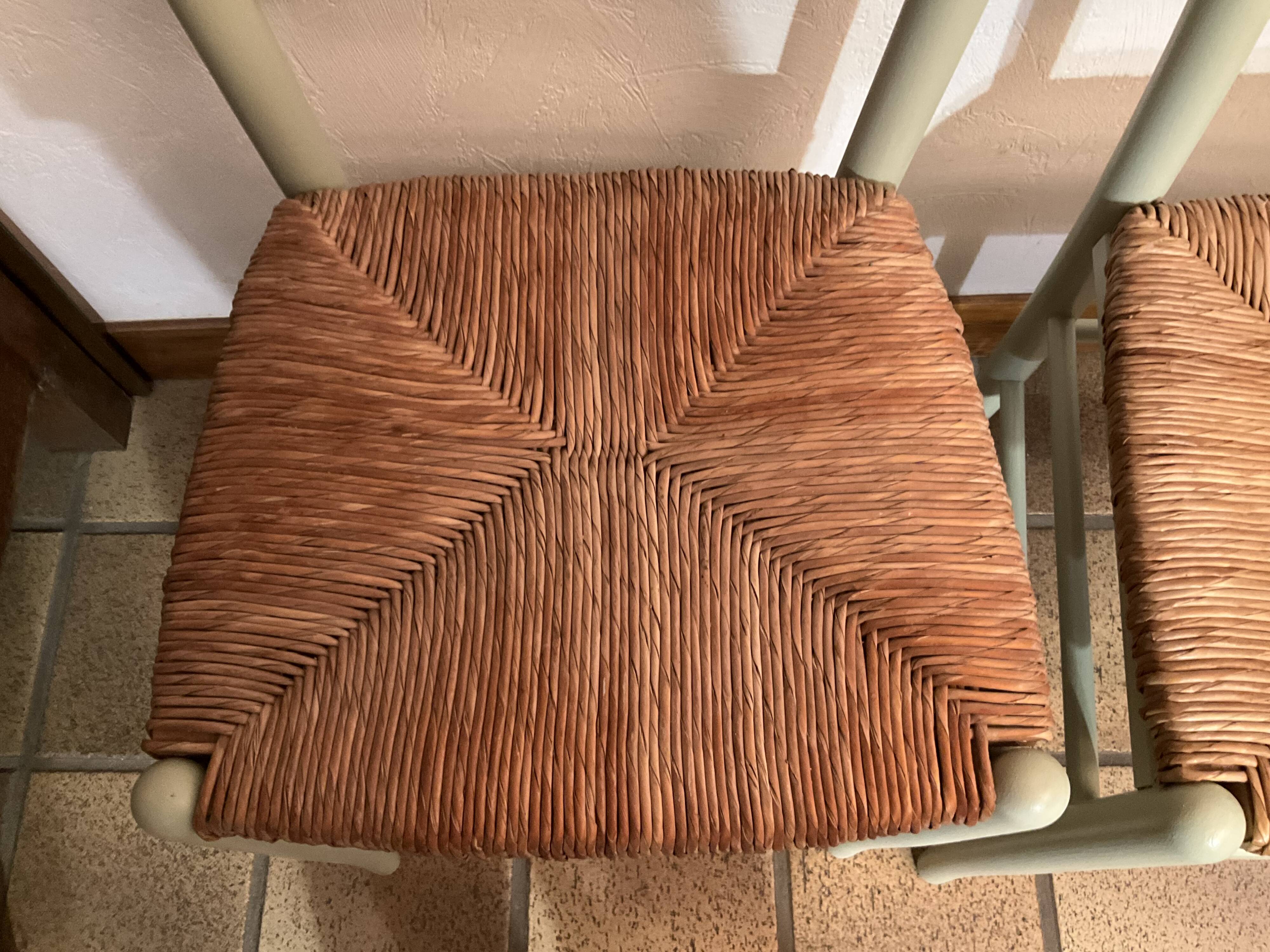 Pair of green straw sitting chairs