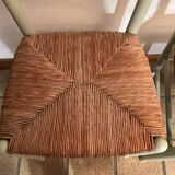Pair of green straw sitting chairs