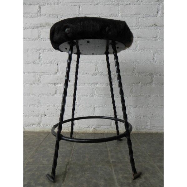 Vintage stool lined with cowhide