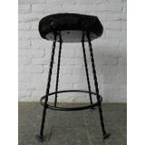 Vintage stool lined with cowhide