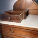 Antique carved wooden dressing table with marble and tilting oval mirror.