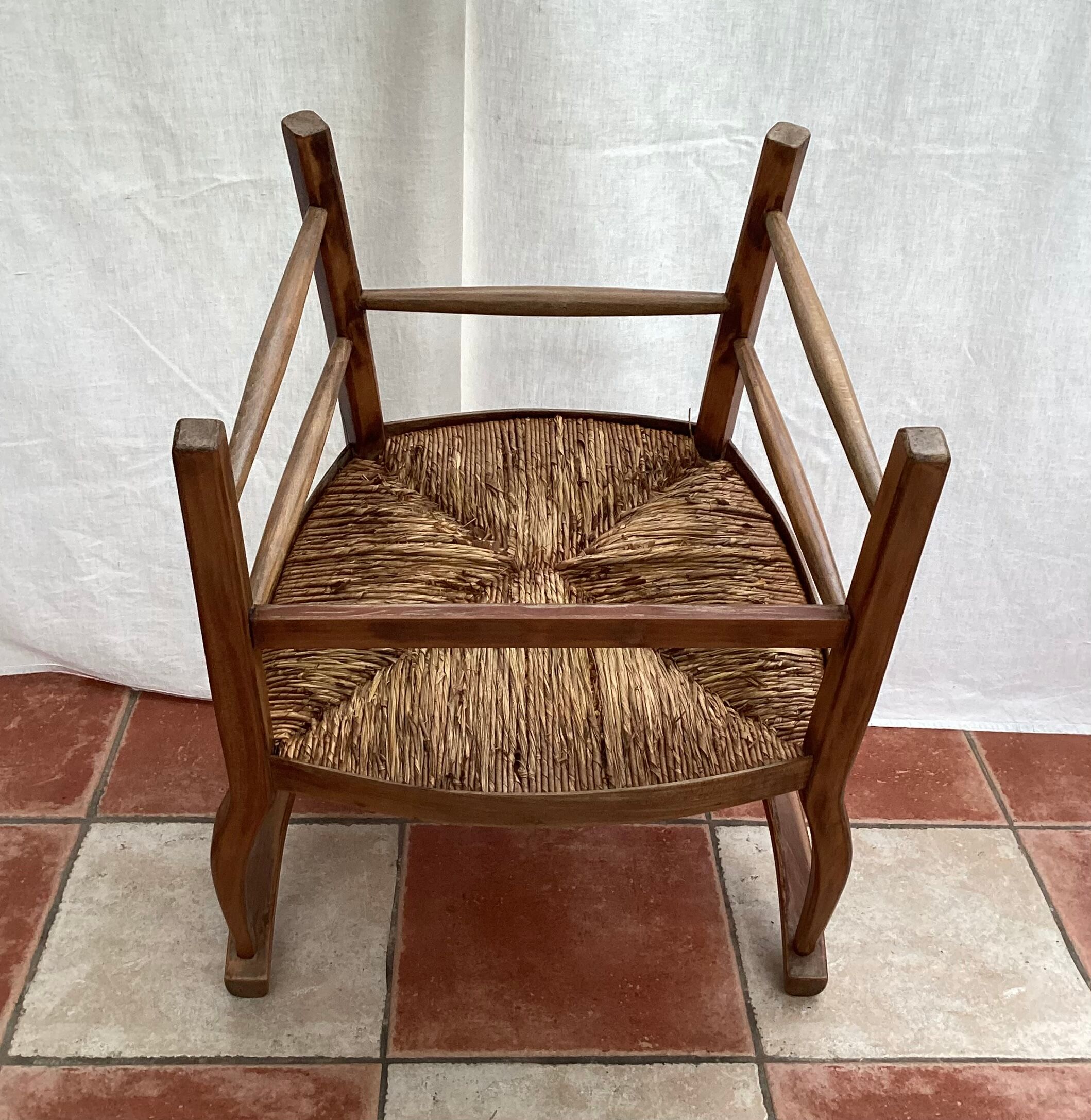 Light wood armchair seated in vintage straw dimension: height -78cm- width -54cm-