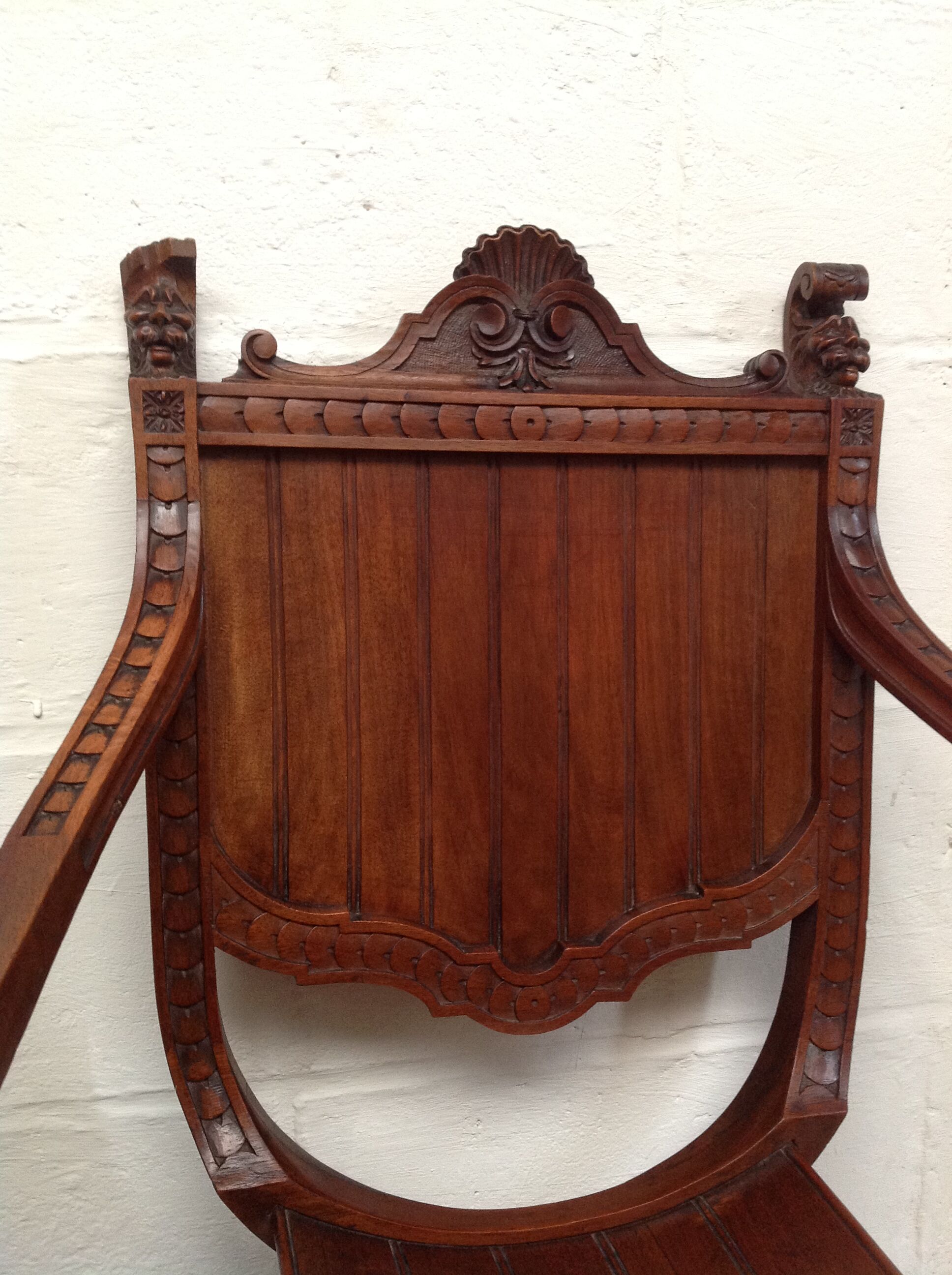Pair of antique armchairs curules called Dagobert in carved wood