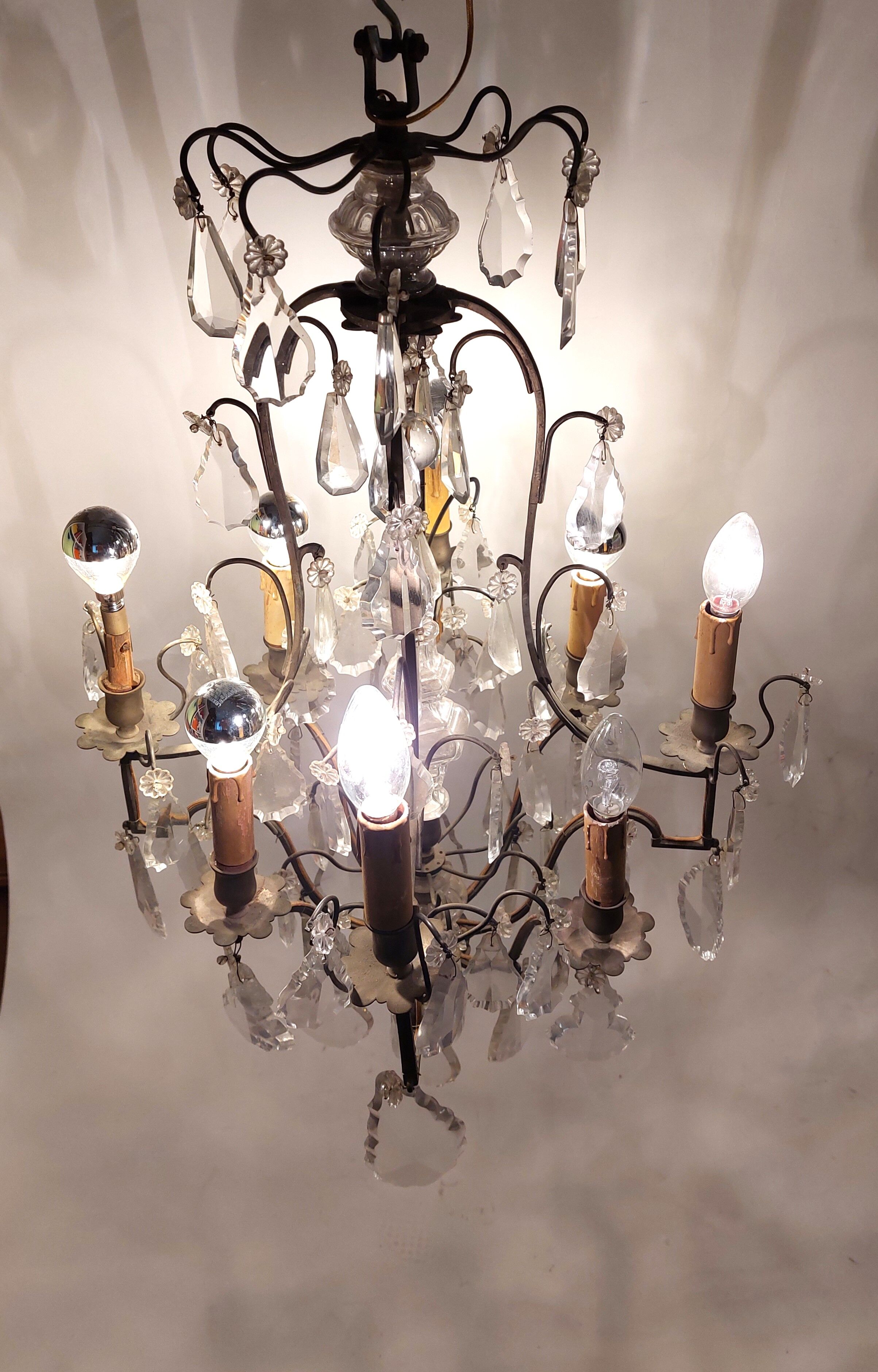 Neoclassical bronze chandelier with 8 lights, tassels and dagger