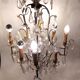 Neoclassical bronze chandelier with 8 lights, tassels and dagger
