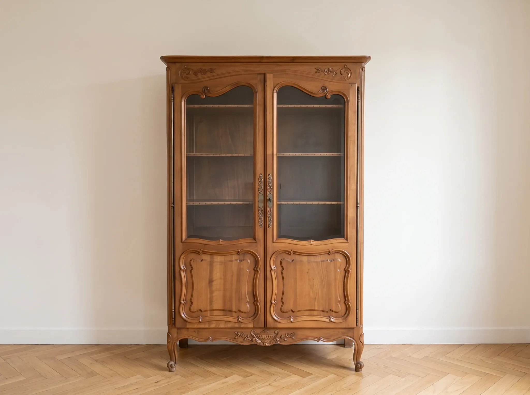 Antique display cabinet in Louis XV style made of wood.
