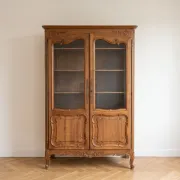Antique display cabinet in Louis XV style made of wood.