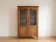 Antique display cabinet in Louis XV style made of wood.