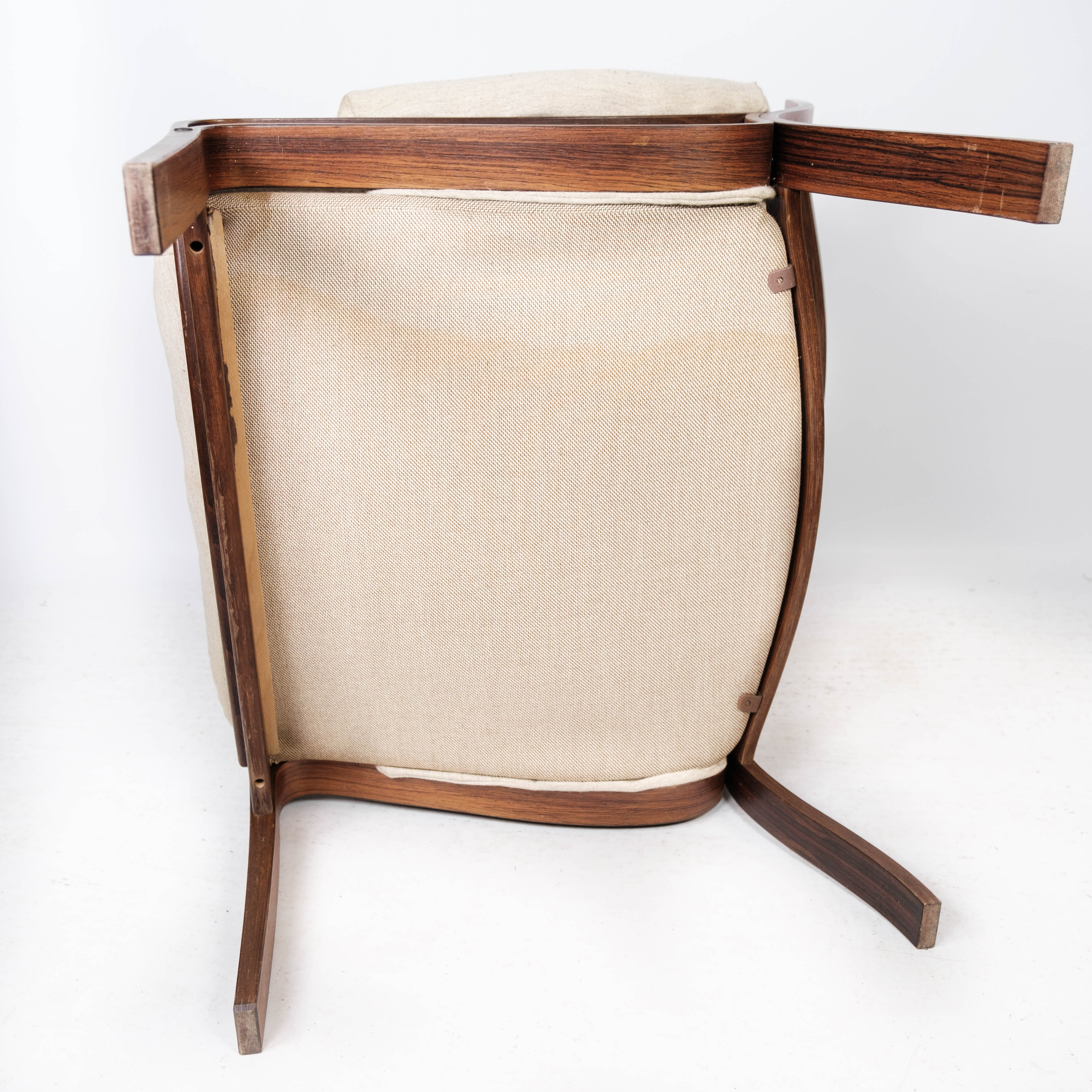 Armchair in rosewood and upholstered with light fabric, of Danish design, 1960s