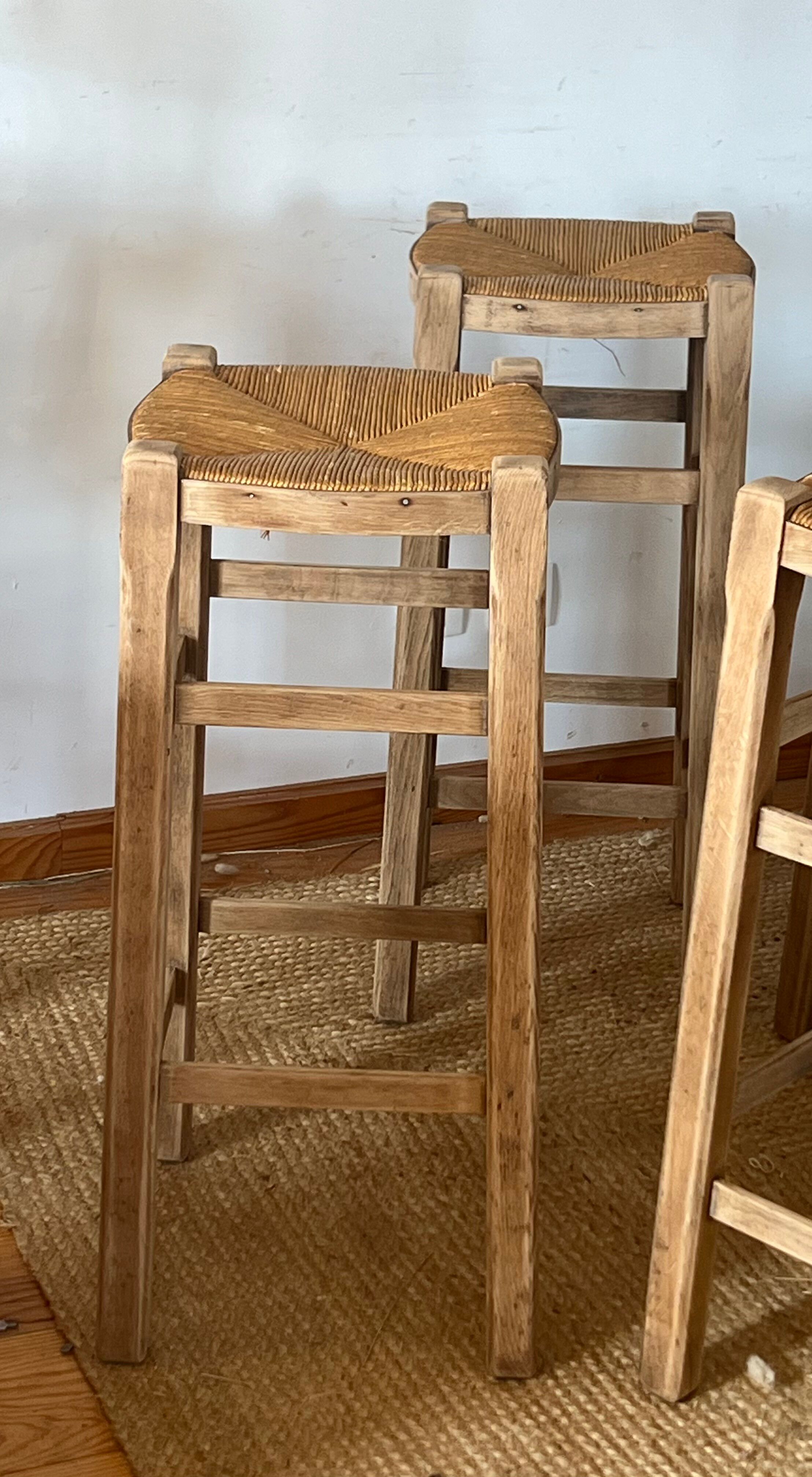 Set of 4 vintage high bar stools in raw solid oak and straw.