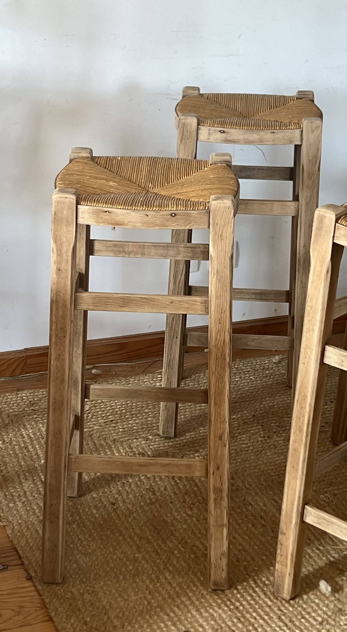 Set of 4 vintage high bar stools in raw solid oak and straw.