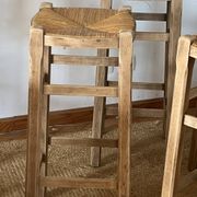 Set of 4 vintage high bar stools in raw solid oak and straw.